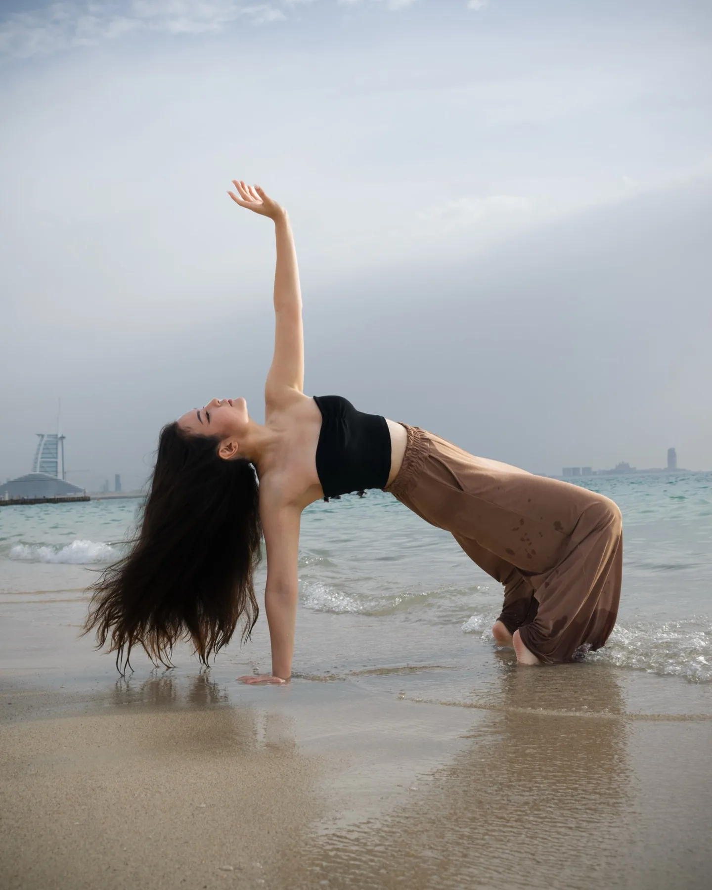 Light breathable outfit photographed at a Dubai beach location